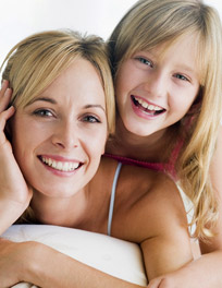 woman and girl smiling