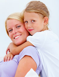 woman and girl smiling